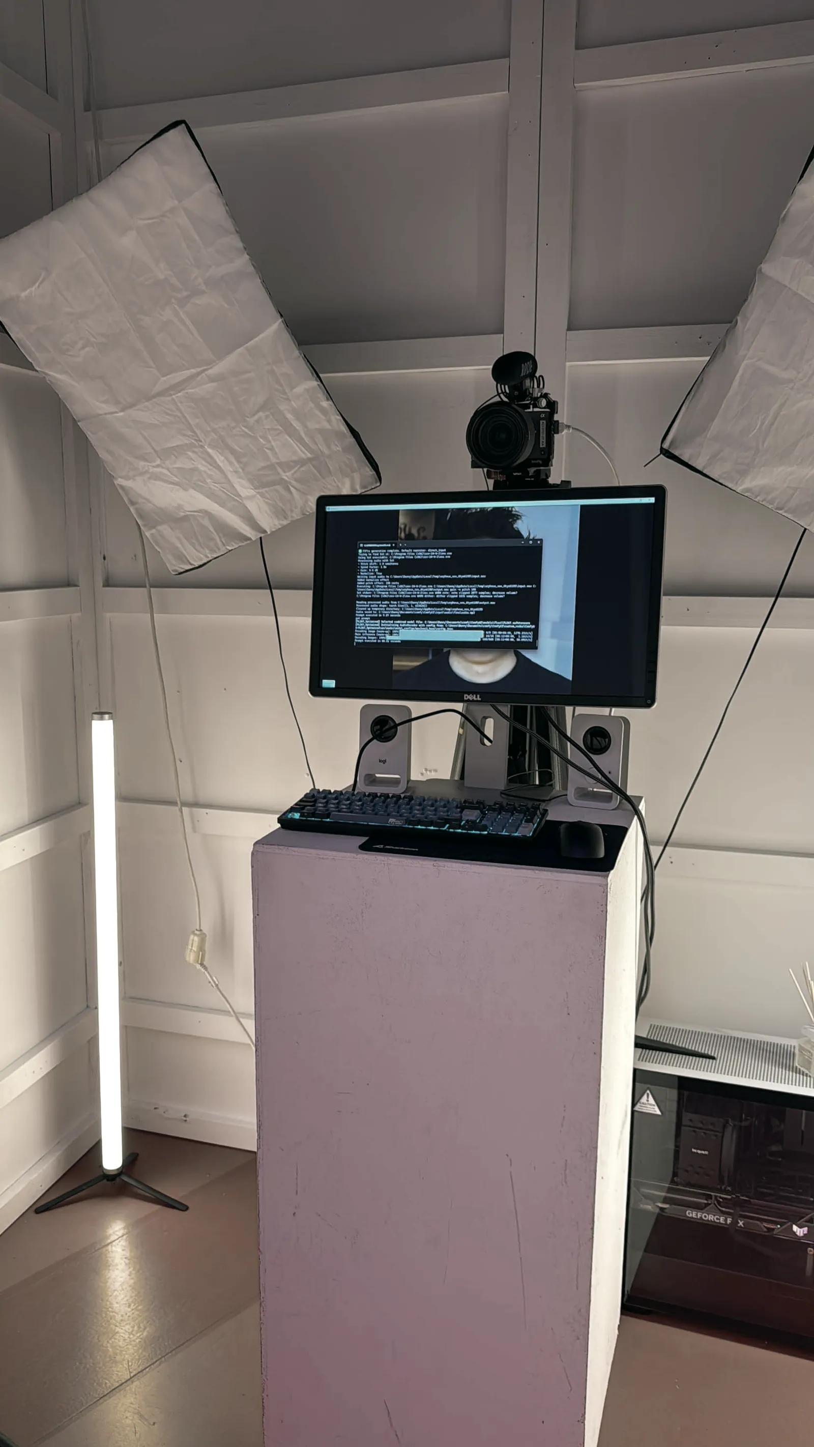 Screen with camera on a white pedestal