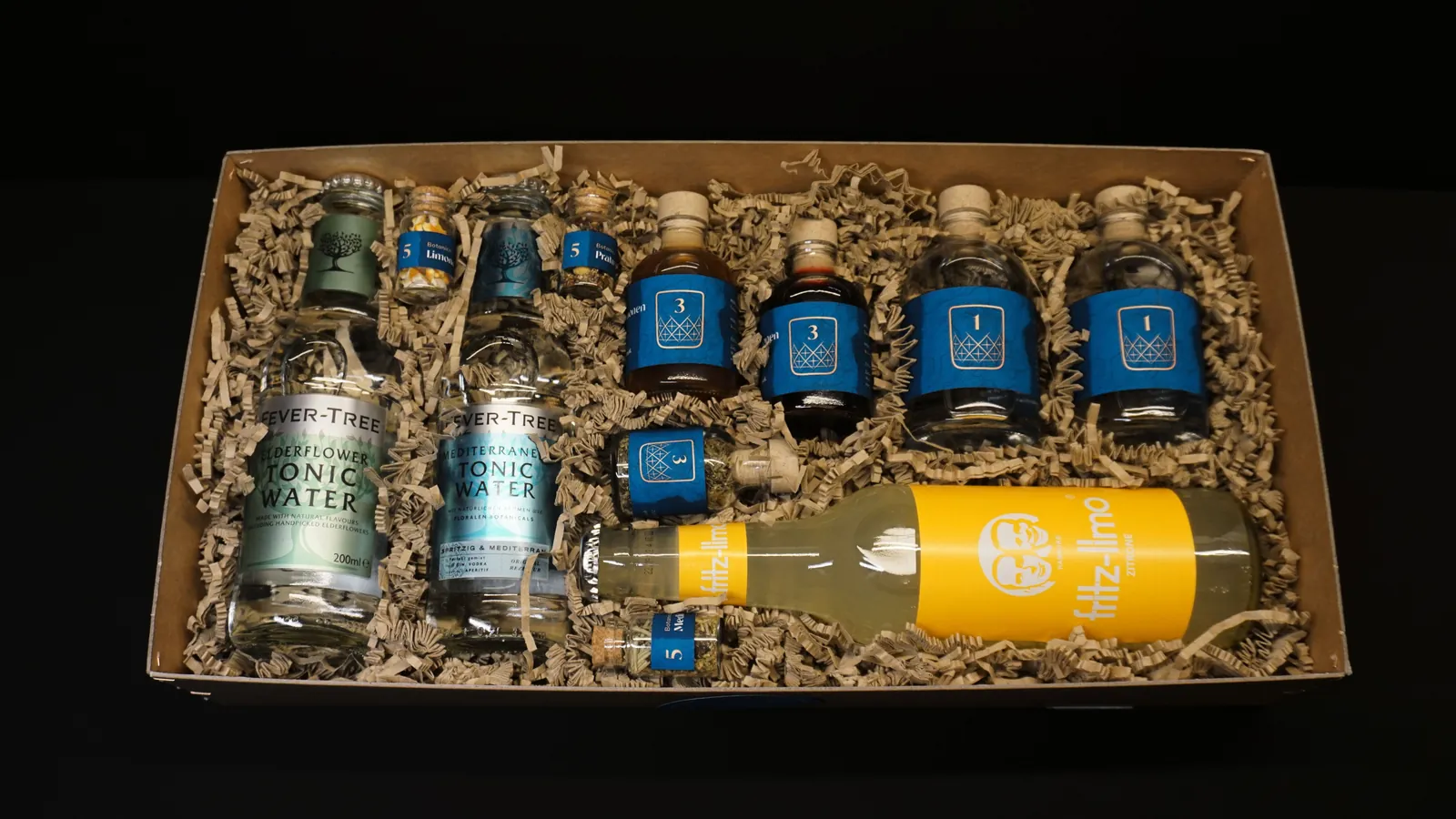 Open box with numbered bottles from above